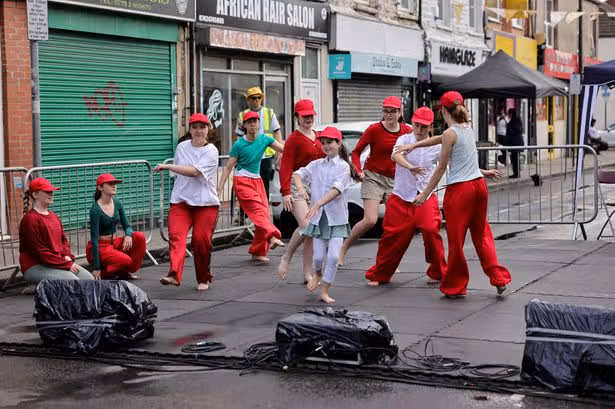 Live performers take over Cardiff street and transform it into stunning carnival