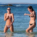 Lila Moss looks just like model mum Kate as she sports a tiny bikini on the beach in Formentera with Charlotte Tilbury’s nepo niece