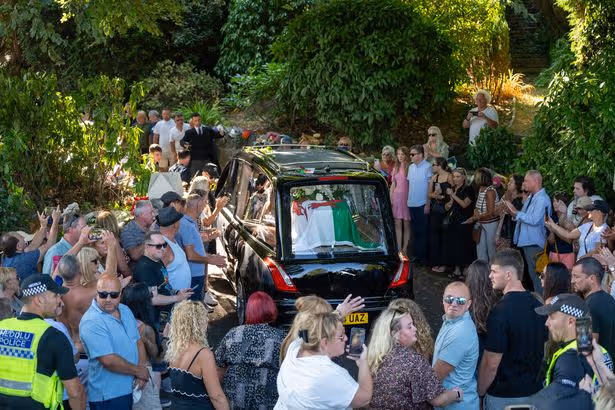 Huge crowds applaud, sing and hold out for a heroine as Bonnie Tyler's coffin returns home