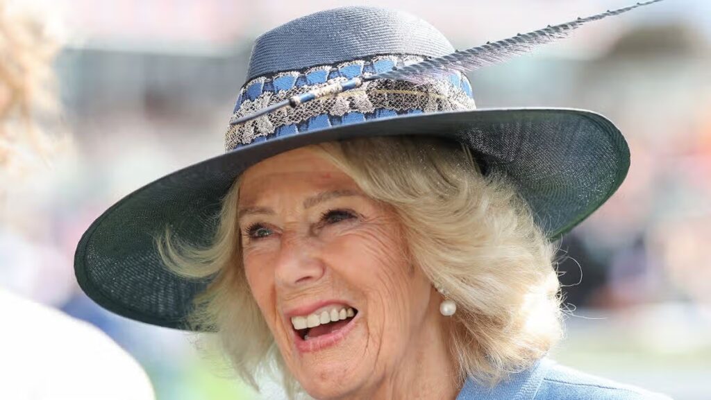 Queen Camilla braves heavy downpours as she breaks away from Balmoral to enjoy York races