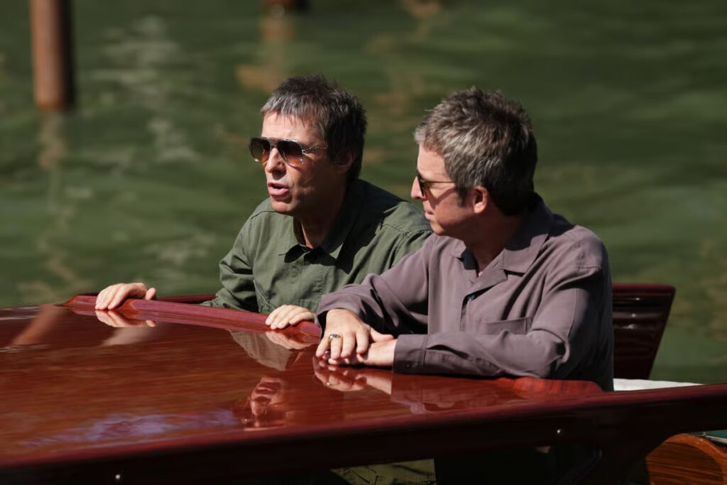 Oasis stars Liam and Noel Gallagher arrive at Venice Film Festival on boat