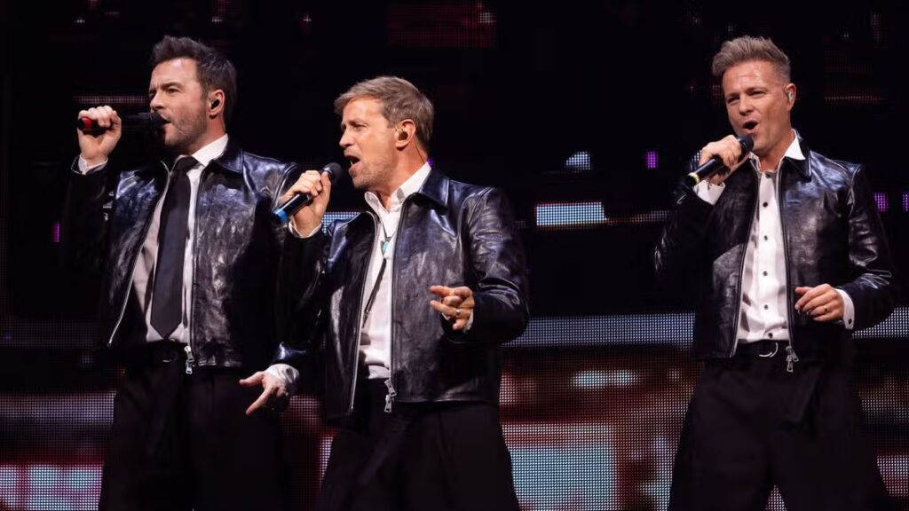 Westlife perform live on stage but women ‘attack them with bras’
