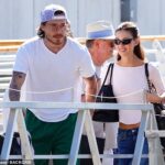 Brooklyn Beckham and wife Nicola Peltz beam as they make low-key departure from Venice Film Festival after loved-up red carpet appearance