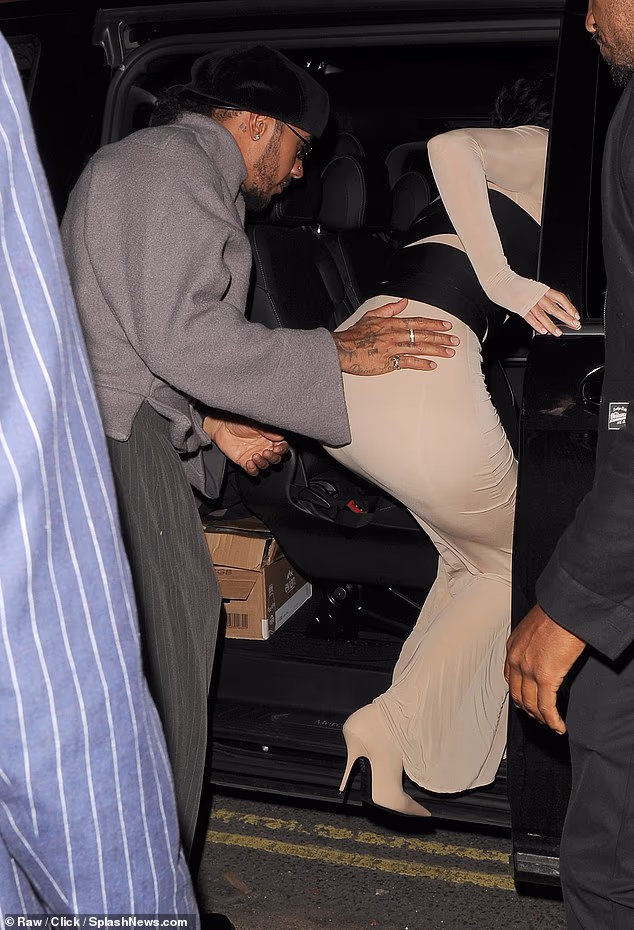 Lewis Hamilton shows his chivalrous side as he places a gentle hand on Kim Kardashian’s back after a romantic date night in London – ahead of her pal Chris Appleton’s Strictly debut