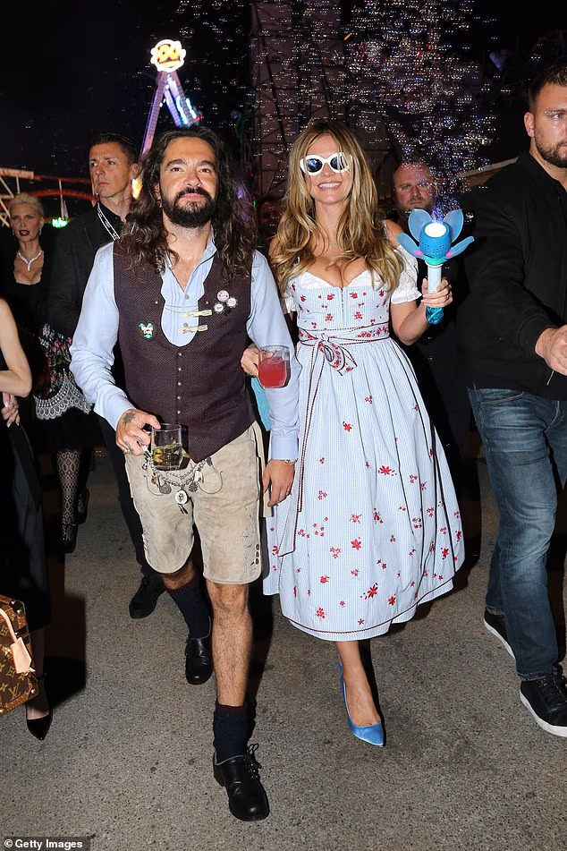 Heidi Klum, 53, and husband Tom Kaulitz, 37, embrace her German roots in traditional outfits as they enjoy date night at Oktoberfest in Munich