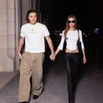 Brooklyn Beckham and Nicola Peltz walk hand in hand as they arrive in the French capital for Paris Fashion Week – just days before estranged mum Victoria’s show