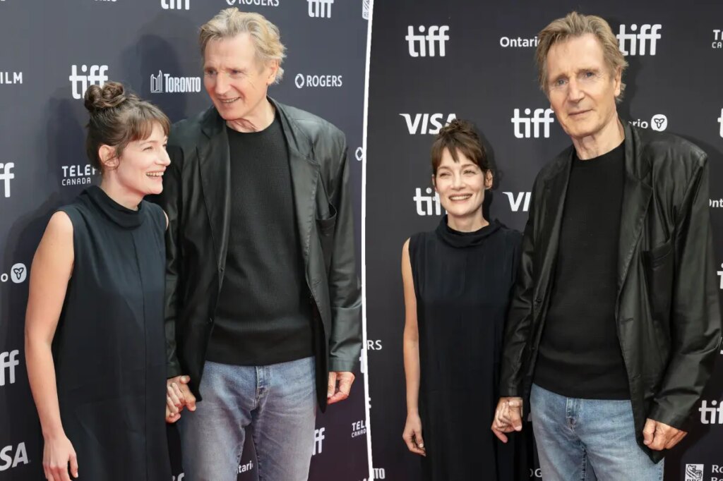 Liam Neeson, 74, holds hands with Stella Stocker on Toronto International Film Festival red carpet