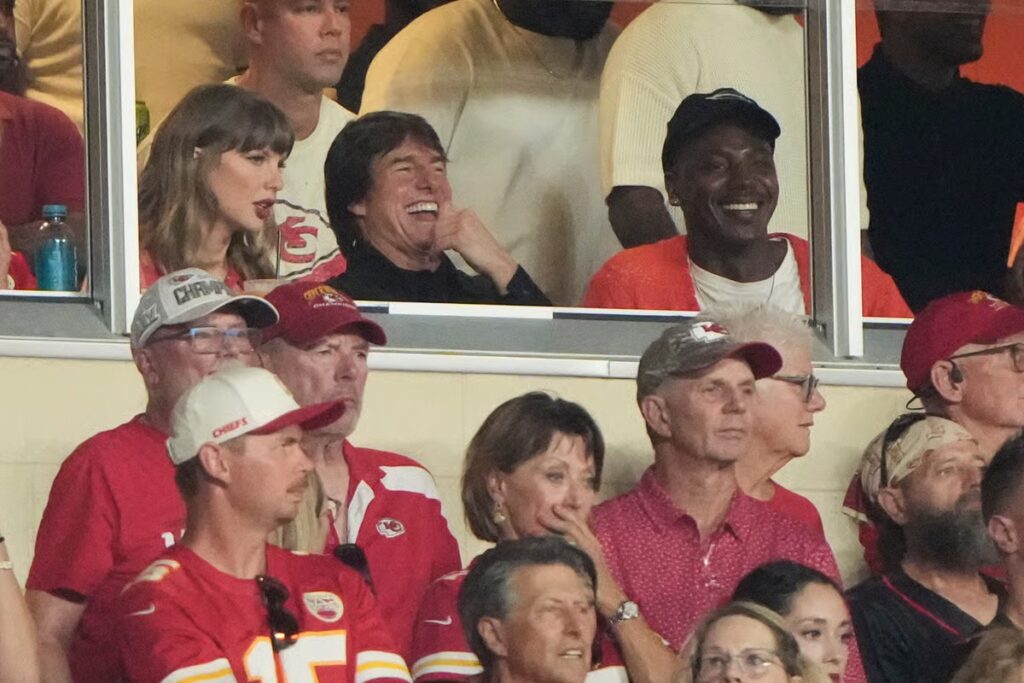 Taylor Swift misses Emmys to cheer on Travis Kelce at NFL game with Tom Cruise