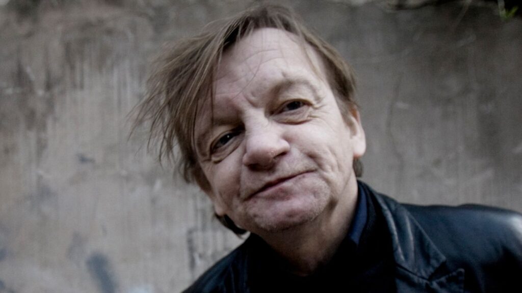 “I have Mark’s actual last recordings – he was working on a cover of Madonna’s Material Girl”: Mark E Smith’s colleagues and partner wrangle over the “final” Fall album