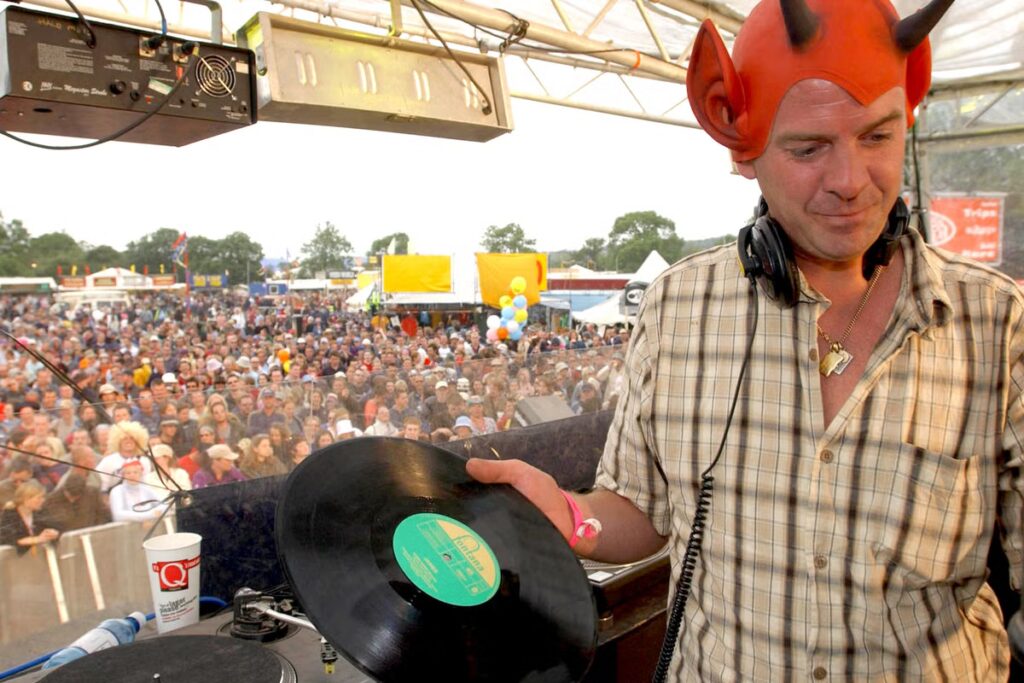 Fatboy Slim has ‘never been paid’ to perform at Glastonbury: ‘It’s the most fun, forward-thinking, beautiful human experience’