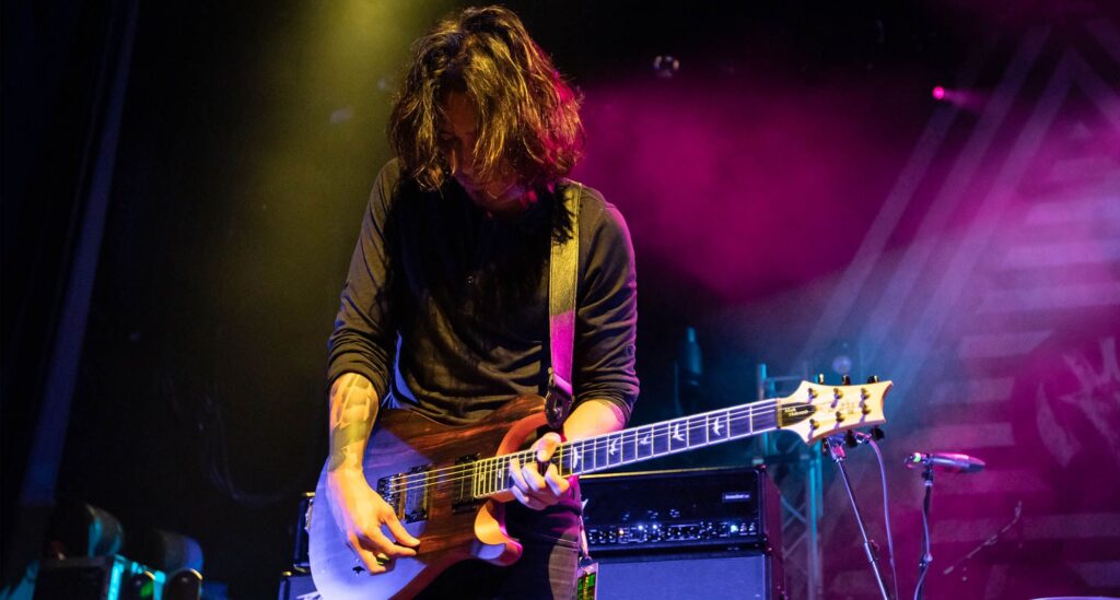 “We tell our guitar techs we’re sorry profusely. I feel horrible for making their lives miserable”: Mark Holcomb on how Periphery harnesses super-heavy guitars for a super-heavy album that takes djent to a dark place
