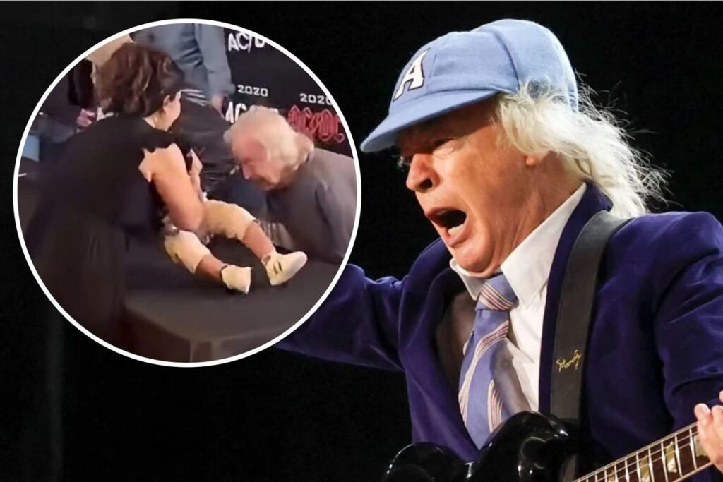 Watch AC/DC’s Angus Young Sign a Fan’s Baby in Toronto