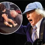 Watch AC/DC’s Angus Young Sign a Fan’s Baby in Toronto