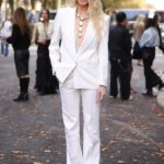 Claudia Schiffer, 56, turns heads in a plunging blazer as she brings some supermodel glamour to Chloe’s Paris Fashion Week show
