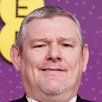 John Davidson to watch Bafta awards from separate room after slur incident