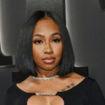 Yung Miami Drops To Low Squat In Shiny Thong, Told ‘Do Better’