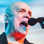 Why is metal guitarist Devin Townsend out on the road again just a year and a half after taking an “indefinite” break from touring?: “Financial armageddon”